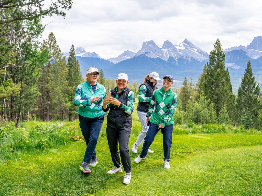 Women Who Golf members laughing together at Silvertip Resort